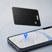 Black ultra-thin tracking card above a smartphone map with blue location pin