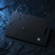 Water droplets and rain splashing across the black tracking card